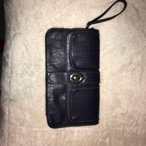 Wristlet. Between navy blue and purple.